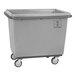 A grey plastic container with wheels.