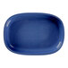 A blue oval porcelain plate with a gold rim.