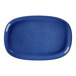 A blue oval RAK Porcelain plate with gold trim.