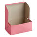 A pink Southern Champion cake box with a lid open.