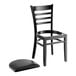 A Lancaster Table & Seating black wood ladder back chair with black vinyl seat