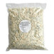 A white bag of Over the Moon Blue Cheese Crumbles.