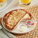 A plate of toast with Honeybrook whipped margarine next to eggs.