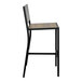 A BFM Seating black powder-coated steel barstool with a knotty pine wood seat and back.