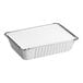 A silver rectangular aluminum foil container with a white board lid.