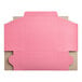 A pink box with a cut out lid.