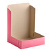 A Southern Champion pink cardboard pie box with the lid open.