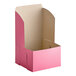 A pink Southern Champion cake box with the lid open.