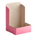 A pink box with a white lid open.