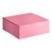 A pink Southern Champion cake box with a lid.