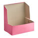 A pink Southern Champion cake box with a lid open.