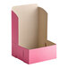 A pink Southern Champion cake box with the lid open.