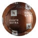 A bag of Nespresso Professional Forte Extra coffee capsules on a counter.
