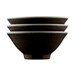 A stack of mushroom-colored melamine bowls with a pebble design on a table.