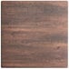 A Lancaster Table & Seating square bar height table with a textured walnut finish.