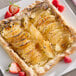 A white plate with sliced pears in light syrup.