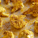 Cauliflower with Badia Curry Powder on a baking sheet.