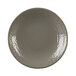 A close-up of an Elite Global Solutions Pebble Creek mushroom-colored plate with a white rim.