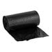 A roll of black plastic Lavex Drawstring Can Liners with a red drawstring handle.