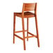 A Lancaster Table & Seating Virelli Tigerwood outdoor side barstool with a slat backrest.