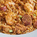 A bowl of rice with shrimp and sausage seasoned with Badia Cajun-Style Seasoning.