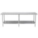 A long stainless steel Advance Tabco work table with a stainless steel undershelf.