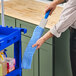 A person holding a Lavex blue duster.