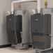 A pair of Rinnai Demand Duo CHS16080HCXiN 80-gallon storage water heaters designed for use with natural gas or liquid propane.