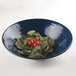 A lapis-colored Elite Global Solutions melamine bowl filled with spinach and tomatoes.