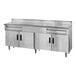 A stainless steel work table with two drawers, four hinged doors, and a 5-inch backsplash.