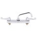 A chrome Equip by T&S deck-mounted workboard faucet with 2 wrist handles and a swing spout.