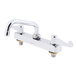A silver Equip by T&S deck-mounted faucet with two wrist handles and a 6 1/8" swing spout.