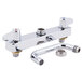A chrome Equip by T&S deck-mounted faucet with lever handles and a swing spout.