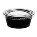 A black plastic souffle container with a clear lid.