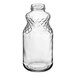 A clear glass juice bottle with a diamond pattern.