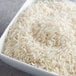 A white bowl filled with Riceland Extra-Long Grain Enriched White Rice.