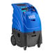 A blue and black Lavex hard surface extractor on wheels.