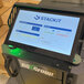 The screen on the RG Group QueBot D Custom Robotic Palletizer with blue and white text.