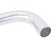 A close-up of a silver curved deck-mounted faucet with white devices on the handles.