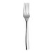 A close-up of a WNK Tuscany stainless steel fork with a white handle.