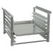 An Advance Tabco aluminum pan rack with four shelves on it.