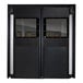 A close-up of a black Aleco double swinging traffic door with windows.