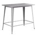 A grey rectangular Lancaster Table & Seating outdoor table with metal legs.
