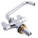 A silver Equip by T&S deck-mount faucet with brass and silver lever handles.