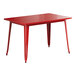 A red rectangular Lancaster Table & Seating outdoor table with metal legs.