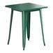 A green Lancaster Table & Seating outdoor table with metal legs.