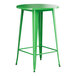 A Lancaster Table & Seating jade green metal bar height table with a round top.