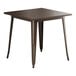 A brown metal Lancaster Table & Seating square table with legs.