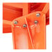 A close-up of the metal screws attached to an orange Lancaster Table & Seating table top.