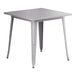 A nickel gray Lancaster Table & Seating Alloy Series square table with legs.